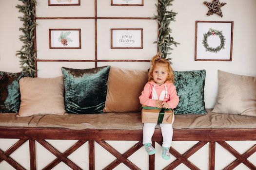 Picture of cute little girl with a gift