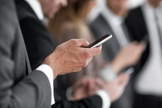 businessman using touch screen smart phone hands close up