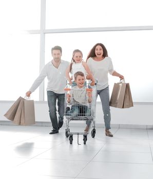 happy family in a hurry to shop.photo with copy space