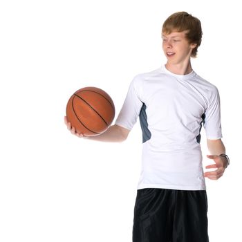 A young red-haired guy playing basketball. The concept of sport, fitness, healthy lifestyle. Isolated on white background.