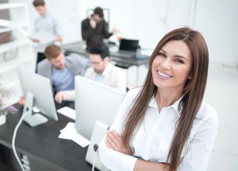 smiling businesswoman standing in a modern office.business people