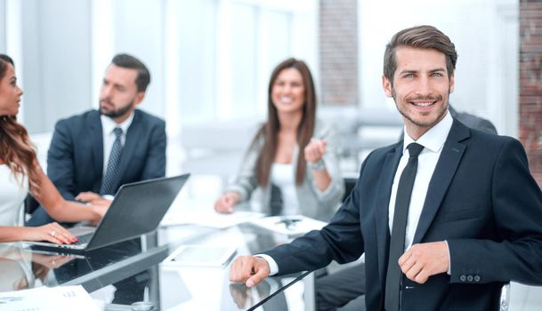 young businessman sitting at the office Desk.photo with copy space