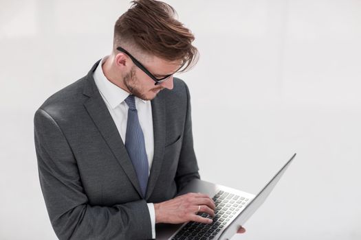 close up.businessman typing text on laptop.isolated on white