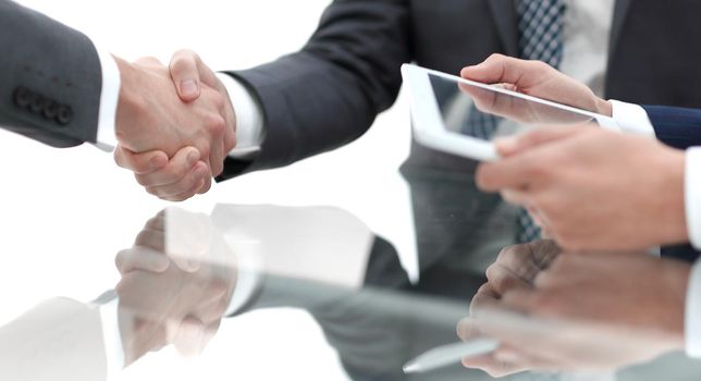 handshake business colleagues in office