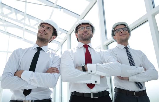 three architects standing in an empty office.business concept