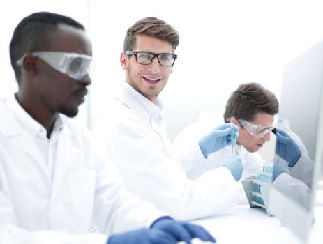 promising scientist working on a computer in the laboratory.science and technology