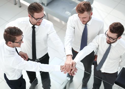top view.a group of employees showing their unity.the concept of teamwork