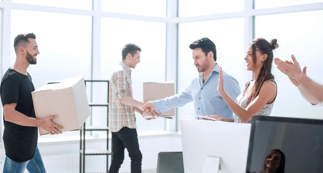 young group of office workers is moving to a new office.photo with copy space