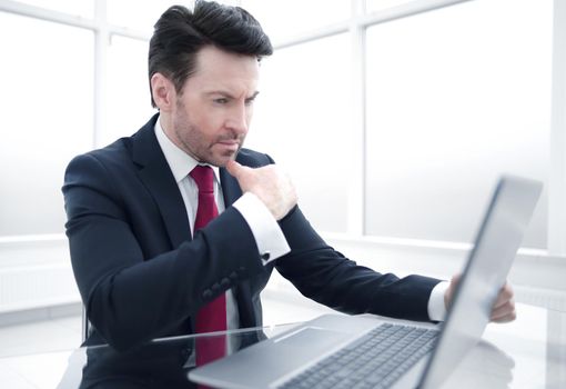 Businessman sitting at his Desk.business and technology.photo with copy space