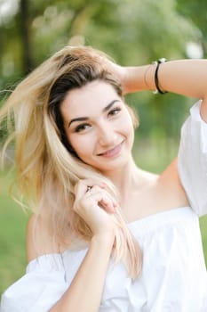 Portrait of young charming girl, green background. Concept of beauty and everyday makeup.