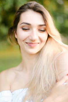 Portrait of young nice caucasian girl, green background. Concept of beauty and everyday makeup.