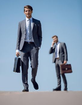 successful young businessman walking down the street.photo with copy space