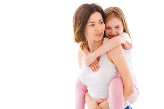 Mother with her little daughter girl playing isolated on a white background