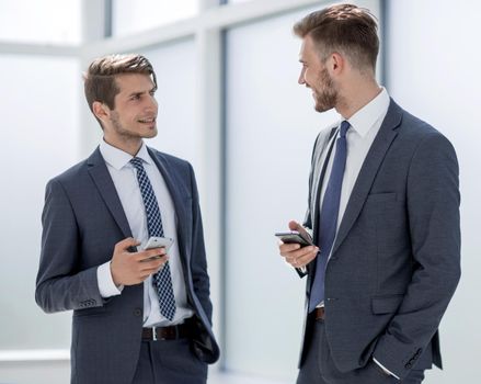 employees standing in the office hallway.office weekdays