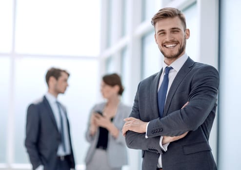 portrait of a successful businessman on the background of the office.photo with copy space