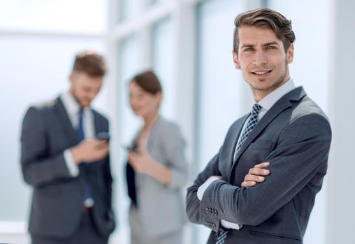 confident young businessman standing in the office.photo with space for text