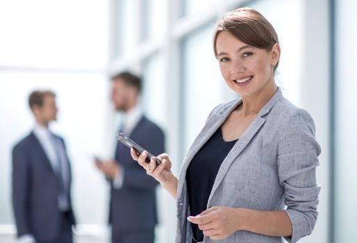 young business woman looking at the screen of her smartphone.photo with space for text