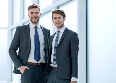 business colleagues standing in a bright office.photo with copy space