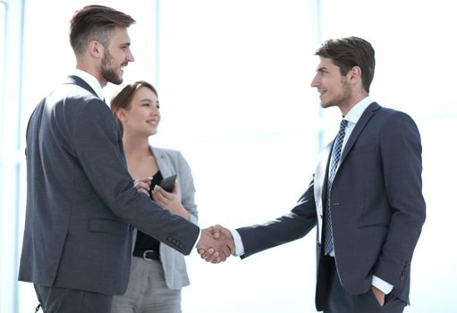 handshake of business partners in a bright office.concept of cooperation