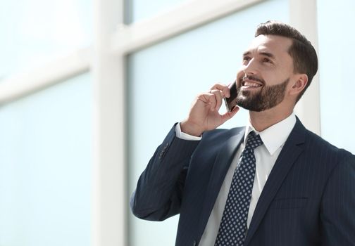 happy businessman talking on mobile phone.photo with copy space