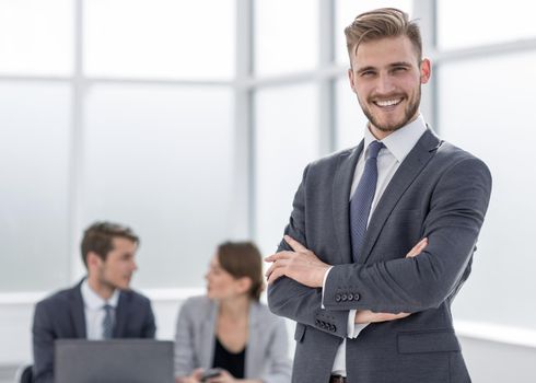 confident businessman in the background of the office.photo with copy space