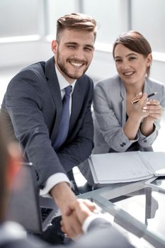 business people shaking hands at a meeting in the office.concept of partnership