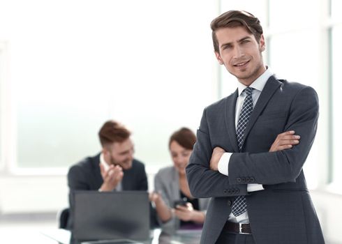 young businessman standing in the office.photo with copy space