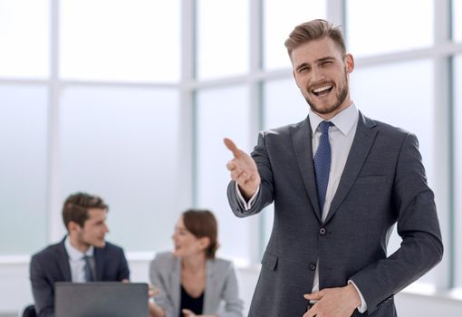 friendly businessman standing in the office.photo with copy space