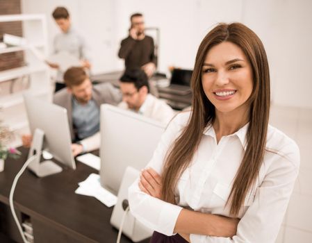 smiling businesswoman standing in a modern office.business people