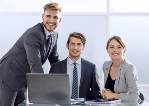 business team sitting at the Desk.photo with copy space