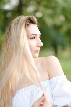 Portrait of young beautiful girl, green background. Concept of beauty and everyday makeup.