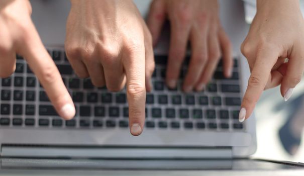 close up.business team using laptop keyboard.people and technology