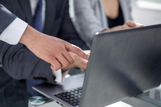 close up.the business team uses a laptop for work.people and technology