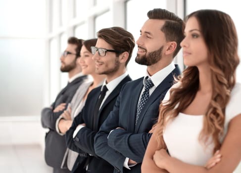 young business team standing in a row.the concept of teamwork