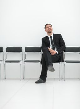 thoughtful businessman sitting in the office hallway.photo with copy space