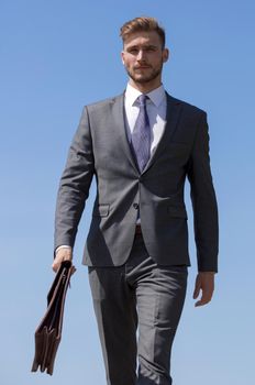 modern young businessman with leather briefcase .business people