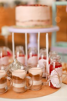 Yummy birthday cake and different sweet drinks on table. Concept of delicious sweets and celebrating party.