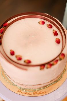 Tasty sweet pink creamy cake with copy space. Concept of celebrating birthday party and food.