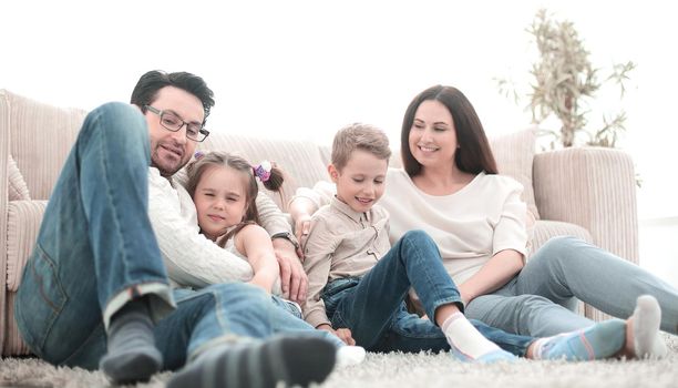 happy family rests in the living room on a free evening.photo with copy space