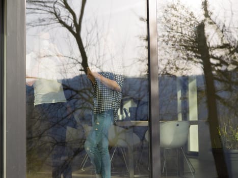 romantic happy young couple enjoying morning coffee by the window in their luxury home