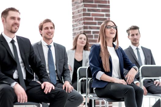 Businesswoman asking questions during seminar