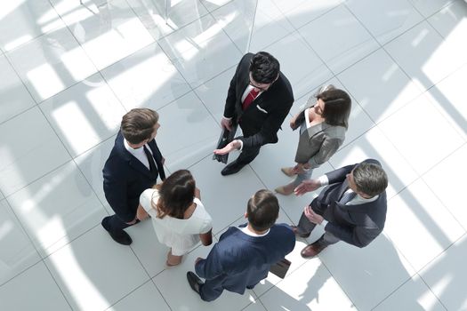 top view. employees standing in a modern office. photo with text space