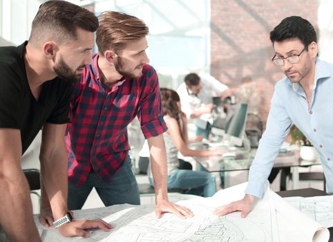 businessman and a group of architects discussing a new project.the concept of cooperation