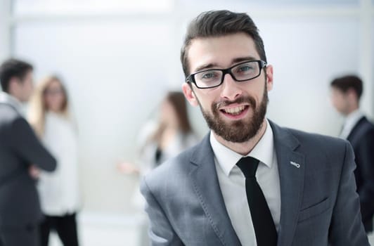 successful businessman on the background of the office.photo with copy space