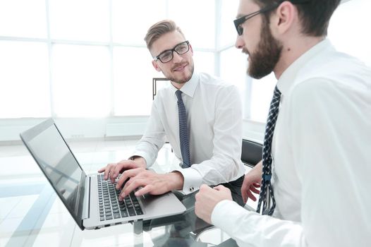 smiling employees at the Desk in the office.photo with copy space