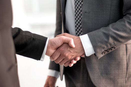 close up. handshake business partners .the concept of cooperation