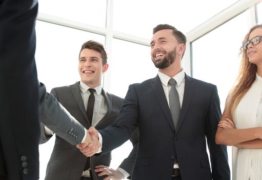 handshake of young business partners in the office.concept of cooperation
