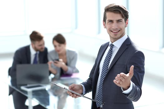 confident young businessman standing in the office.photo with copy space
