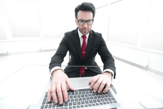 close up.businessman typing on laptop keyboard.people and technology