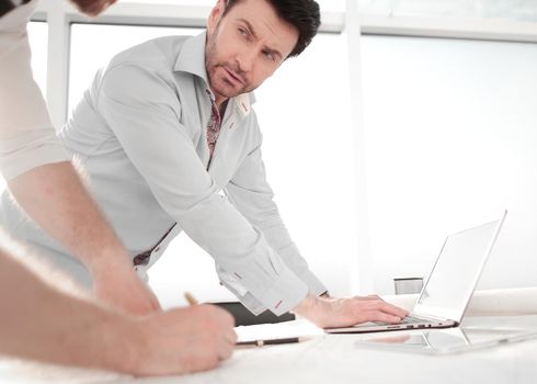 two architects use a laptop for work. photo with copy space